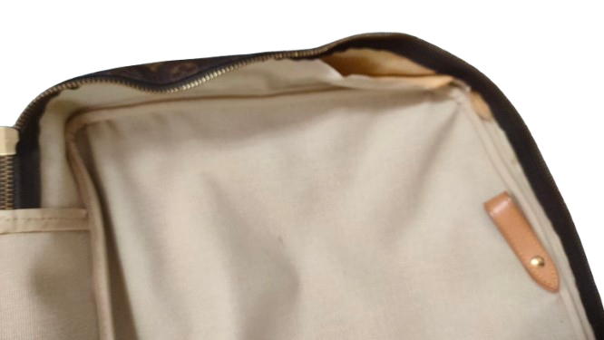 Louis Vuitton Sirius 70 interior showing pocket and vachetta trim
