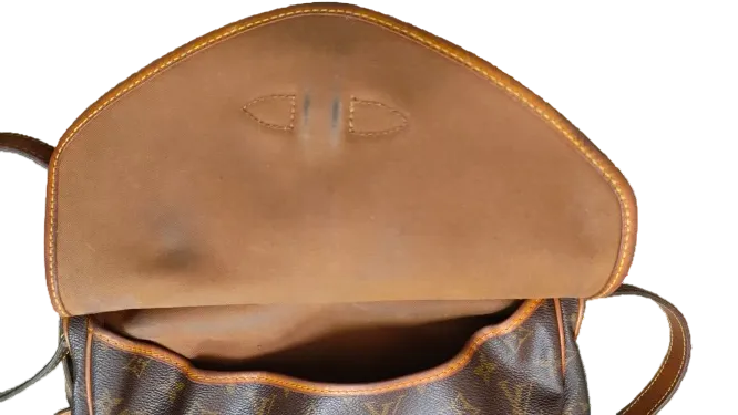 Louis Vuitton Saumur 30 interior vachetta flap panel showing staining condition
