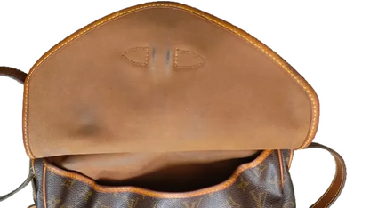 Louis Vuitton Saumur 30 interior vachetta flap panel showing staining condition