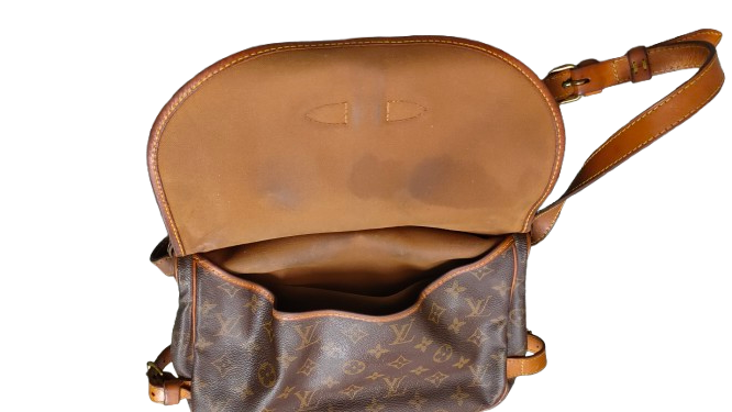 Louis Vuitton Saumur 30 second interior vachetta flap panel showing staining condition