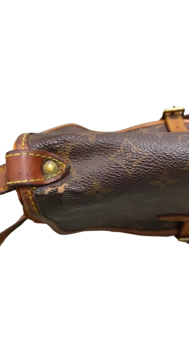 Louis Vuitton Saumur 30 side profile showing strap attachment and hardware detail
